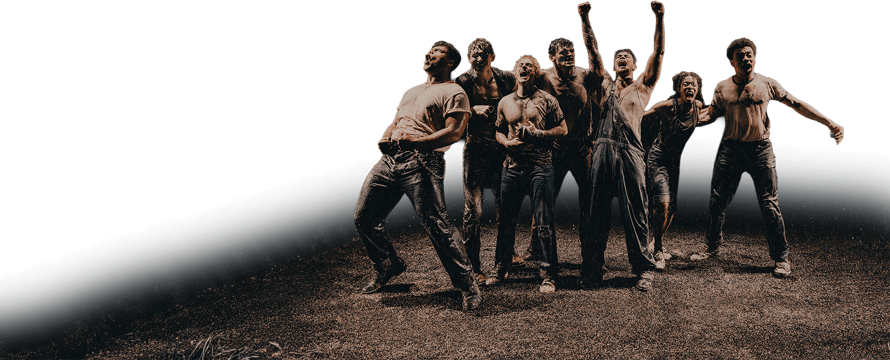 Seven men in dirty jeans and t-shirts stand on a grassy field, some celebrating with raised arms and excited expressions, suggesting a moment of triumph or camaraderie. The background is mostly white.
